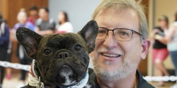 Scott D. Ryan holds his French Bulldog, Moose