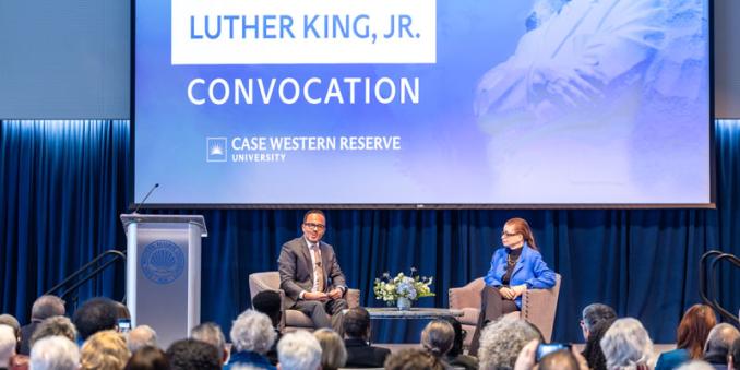 Dexter Voisin sits and speaks with Valerie Jarrett on stage
