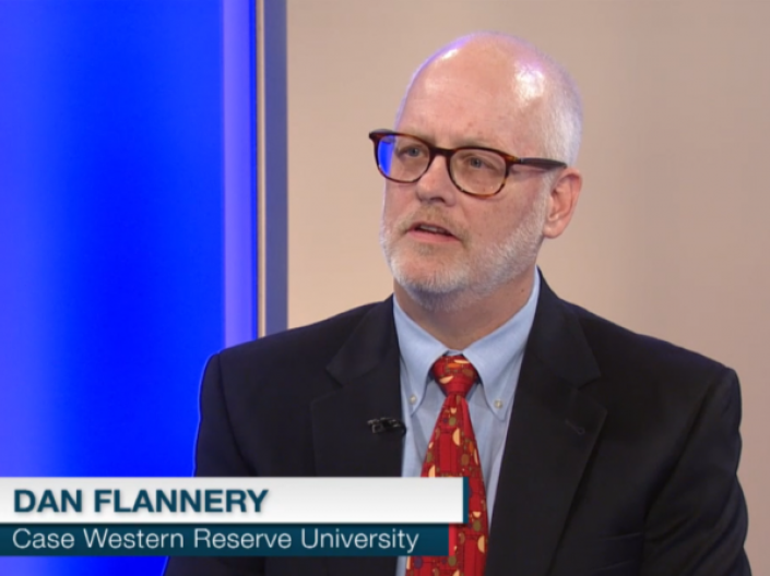 Image of Dr. Daniel J. Flannery as guest on Ideas, with caption in left corner with text Dan Flannery, case western reserve university, in blue and white, with a letter i in a circle