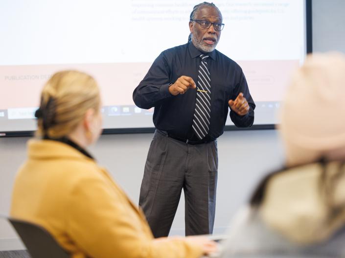 Dr David Miller teaching in a classroom