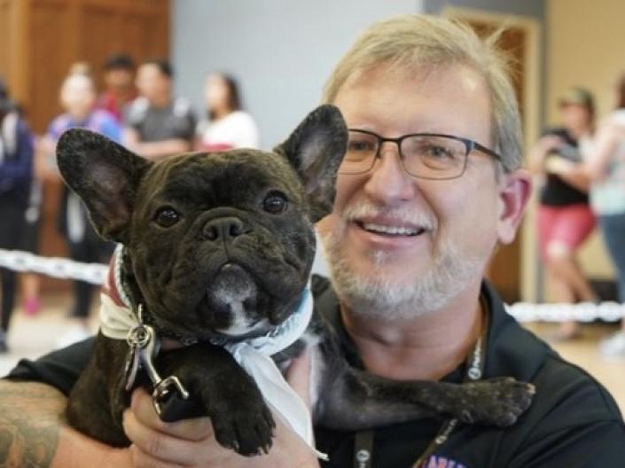 Scott D. Ryan holds his French Bulldog, Moose