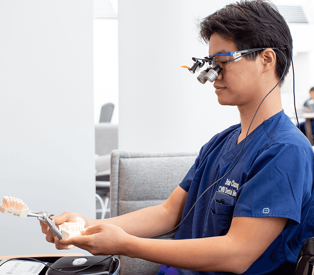 A dental student performing hands on research.