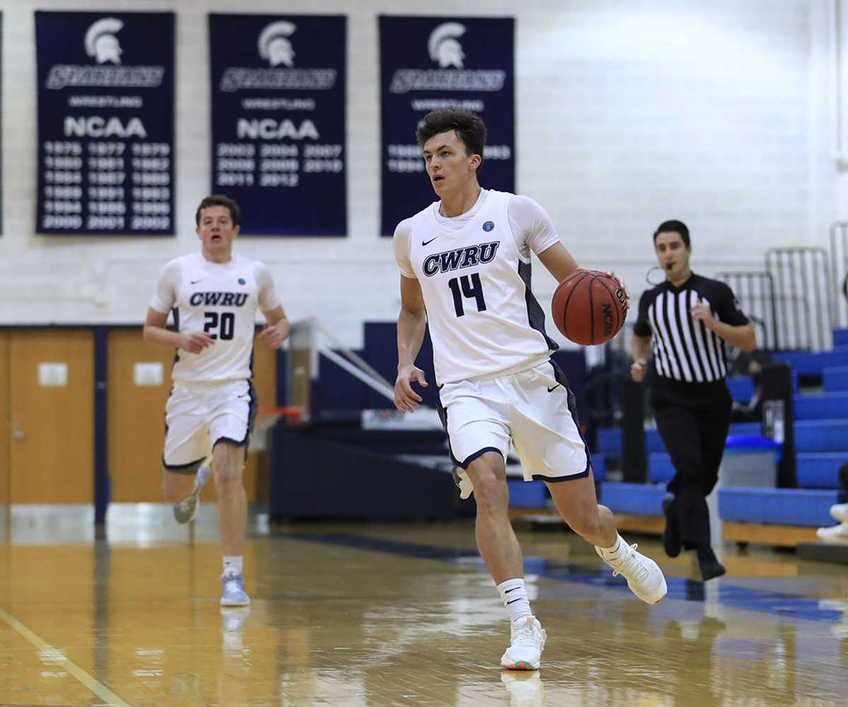 Photo of a Case Western Reserve University men’s basketball player dribbling during a game