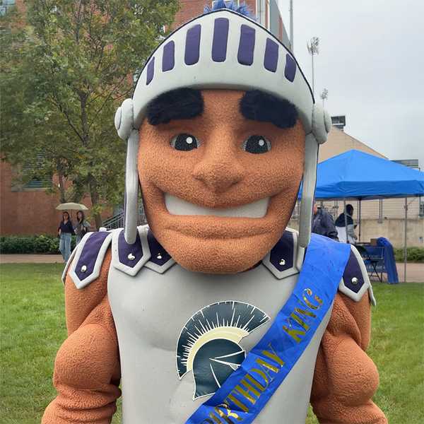 CWRU’s Spartan mascot Spartie wearing a birthday sash.