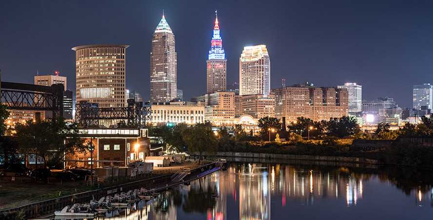 Photo of Cleveland, Ohio, skyline at night with Cuyahoga River in view