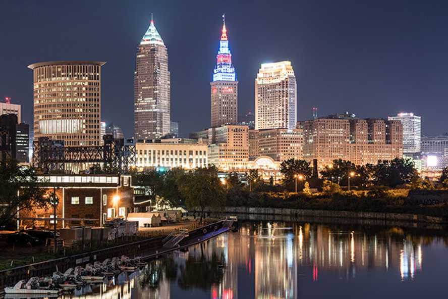 Photo of Cleveland, Ohio, skyline at night with Cuyahoga River in view