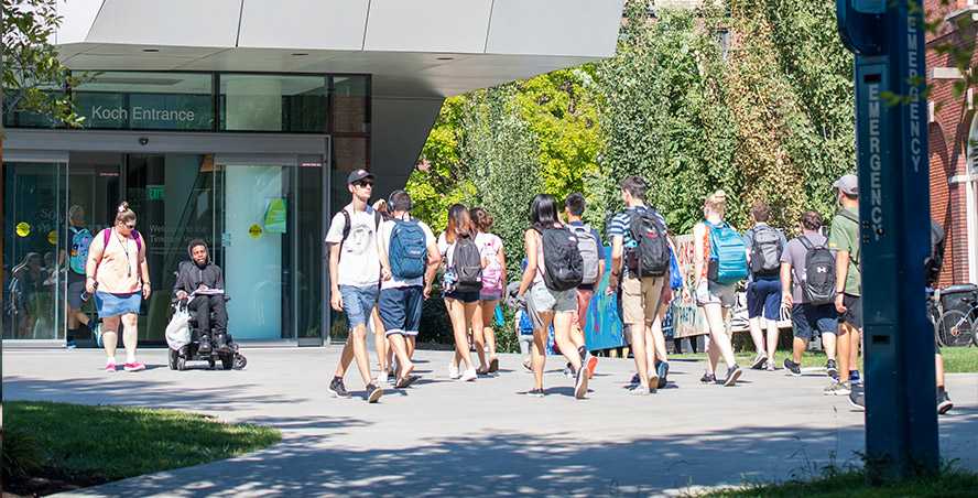 Photo of a group of Case Western Reserve University students walking toward Tinkham Veale University Center