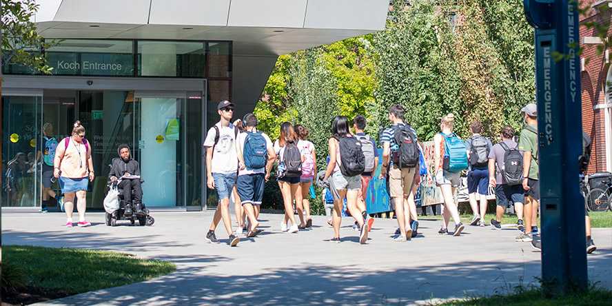 Photo of a group of Case Western Reserve University students walking toward Tinkham Veale University Center