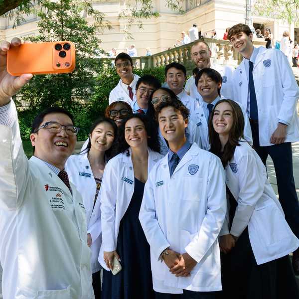 A group of incoming medical school students pose for a selfie at the Case Western Reserve University White Coat Ceremony.