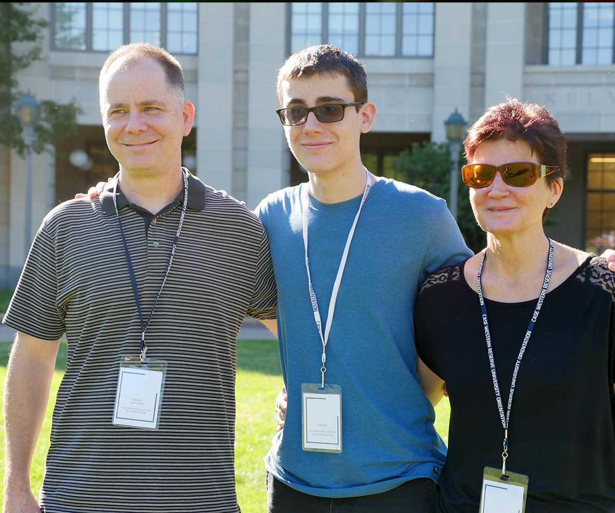 Photo of a Case Western Reserve University student and parents at orientation