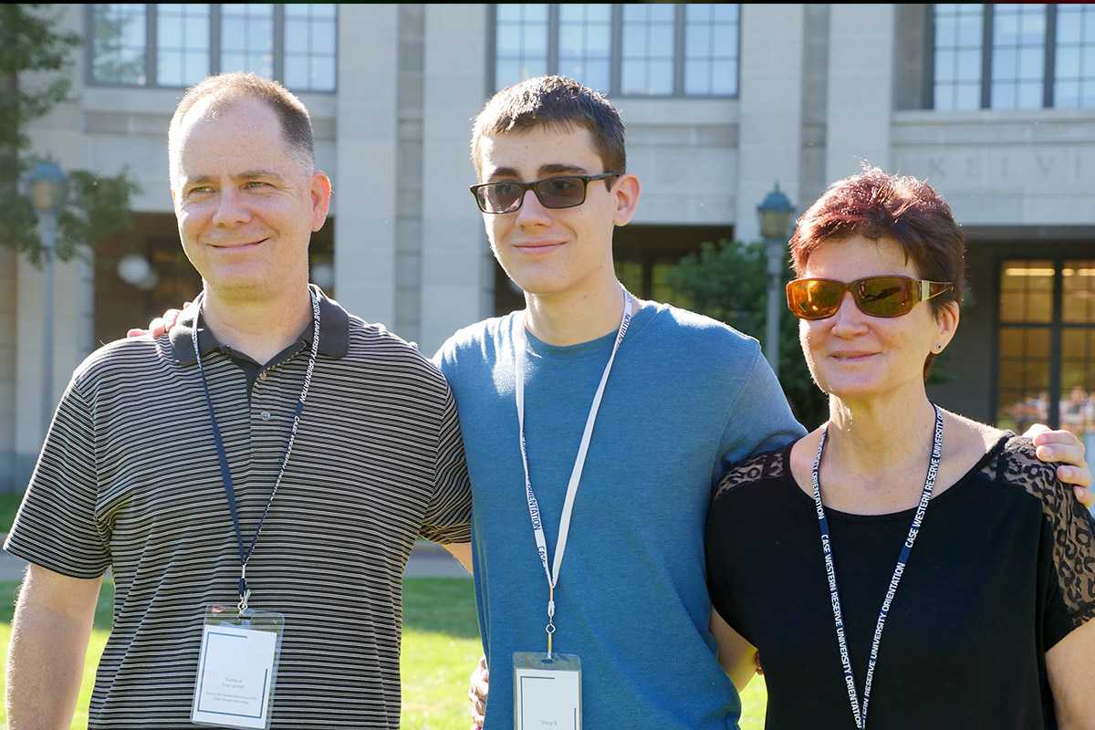 Photo of a Case Western Reserve University student and parents at orientation