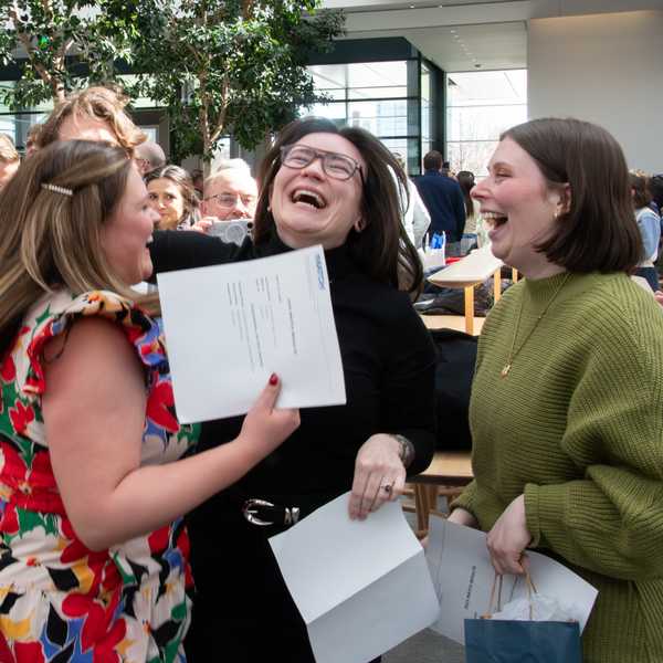 A group of three women smiling, jumping and celebrating at CWRU’s Match Day event.