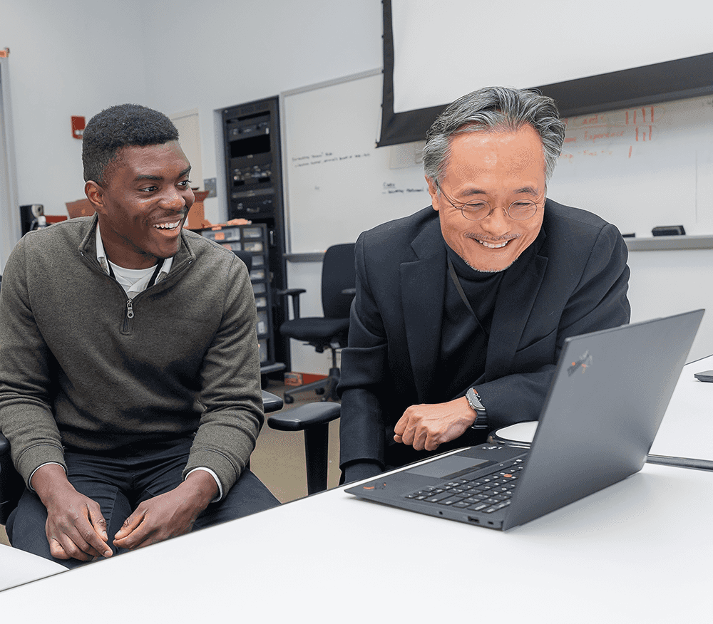 CWRU Weatherhead School of Management Professor working with a student on real-life market scenarios.