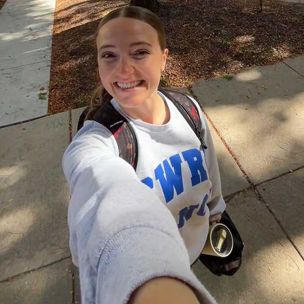 CWRU student Baylee Van Patten holding her phone out for a selfie video.