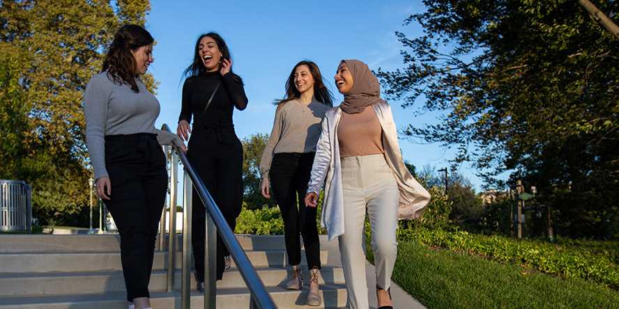 Photo of a group of Case Western Reserve University students walking down steps at the Nord Family Greenway