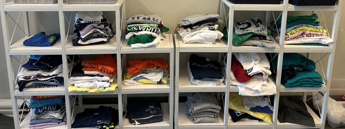 Photo of the many t-shirts available to swap for in the SAL office.