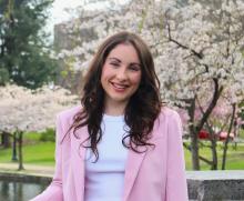 Heasdshot of a woman in a pink blazer