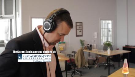 Gordon wearing headphones looking at a desk