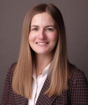 Alexis smiling in updated headshot 2026