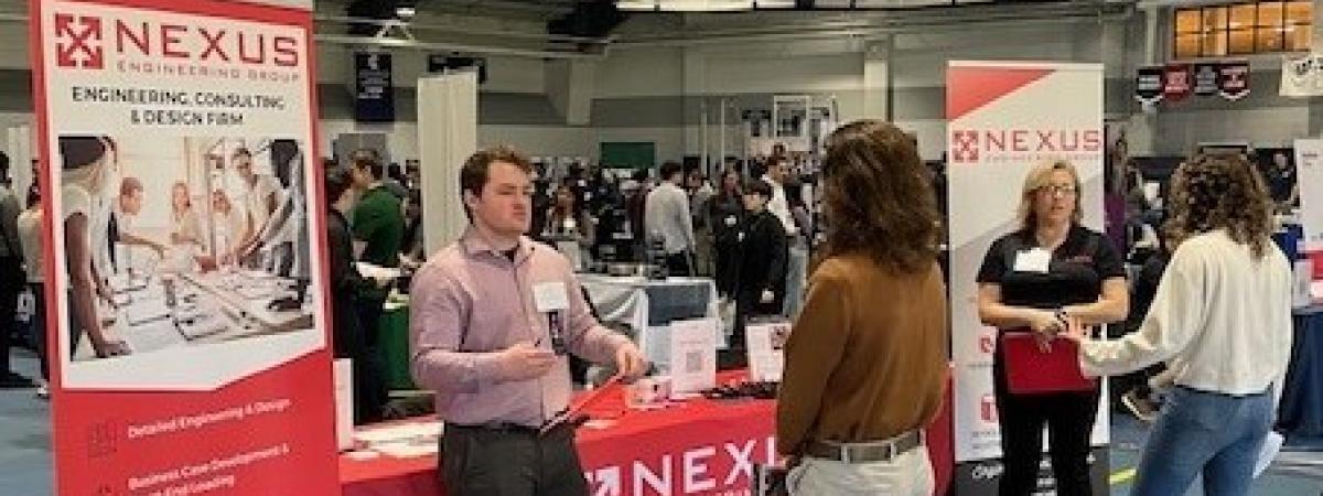 Nexus engineering recruiters speak with students at the career fair