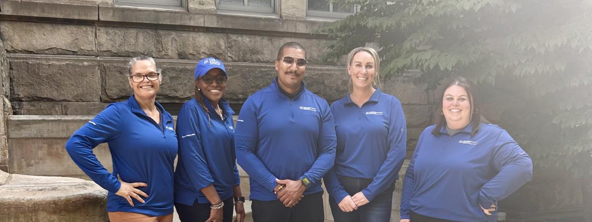 The Dean of Students Staff standing in front of Adelbert Hall