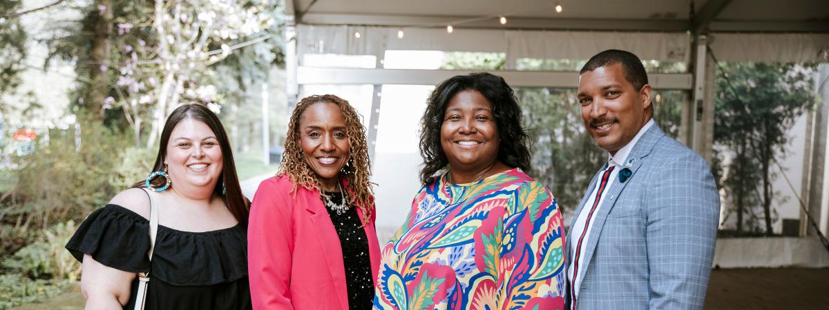 The Dean of Students Office standing with Dr. Kari A. Cunningham