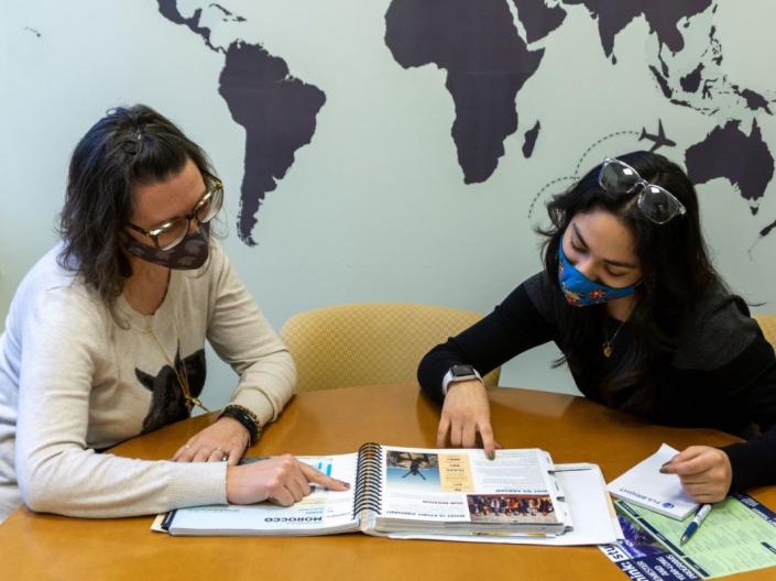 Study Abroad Advisor Cami Ross meeting with a student to discuss opportunities abroad