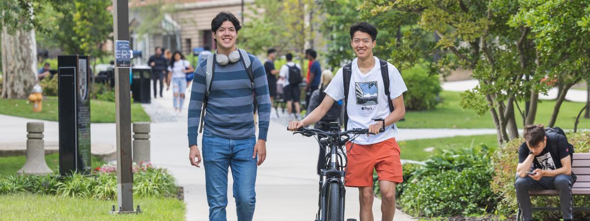 Two students walking on the quad on the first day of class