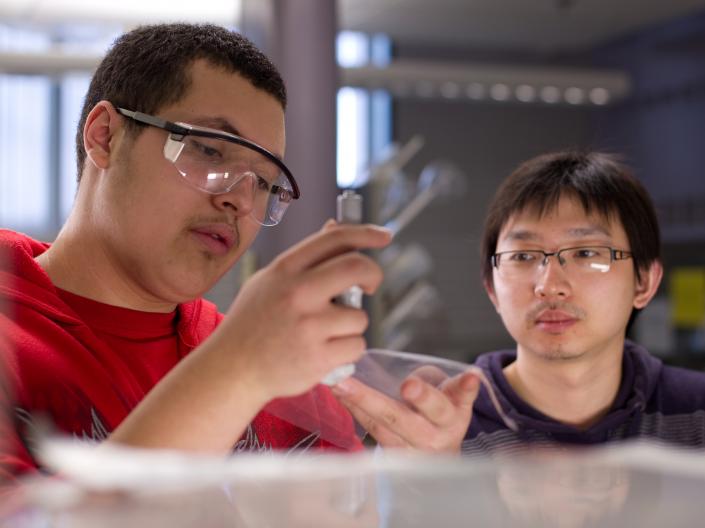 Two students working in a lab
