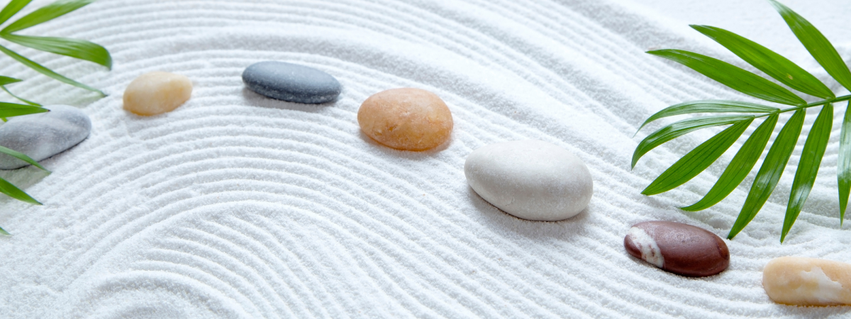 Colorful stones on white sand 