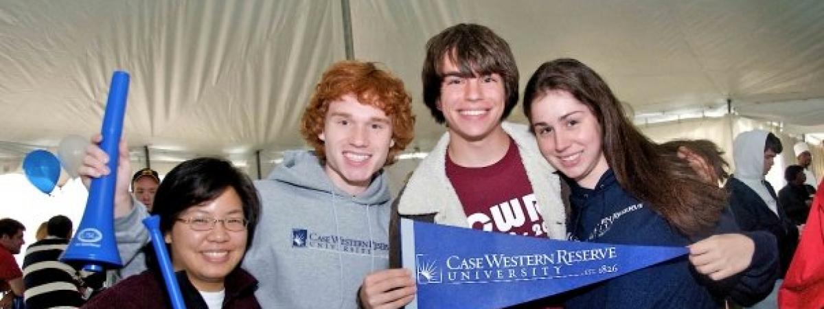 Four first-year students celebrating during orientation