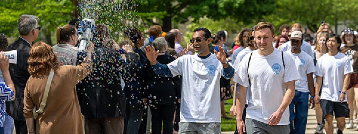 Students walking at Clap Out Event on Quad