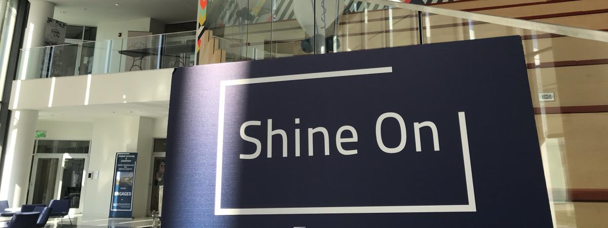 Sign saying "Shine On" in Tinkham Veale University Center