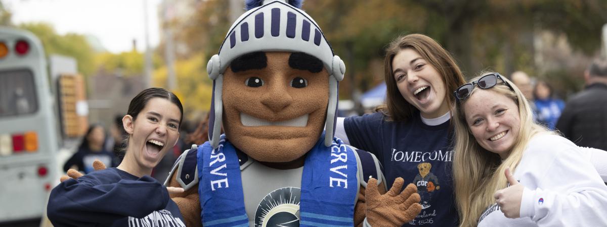 Students pose with Spartie at Homecoming