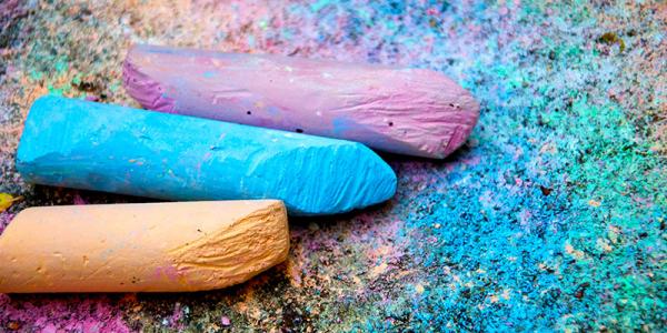 Sidewalk chalk in pink, blue and yellow