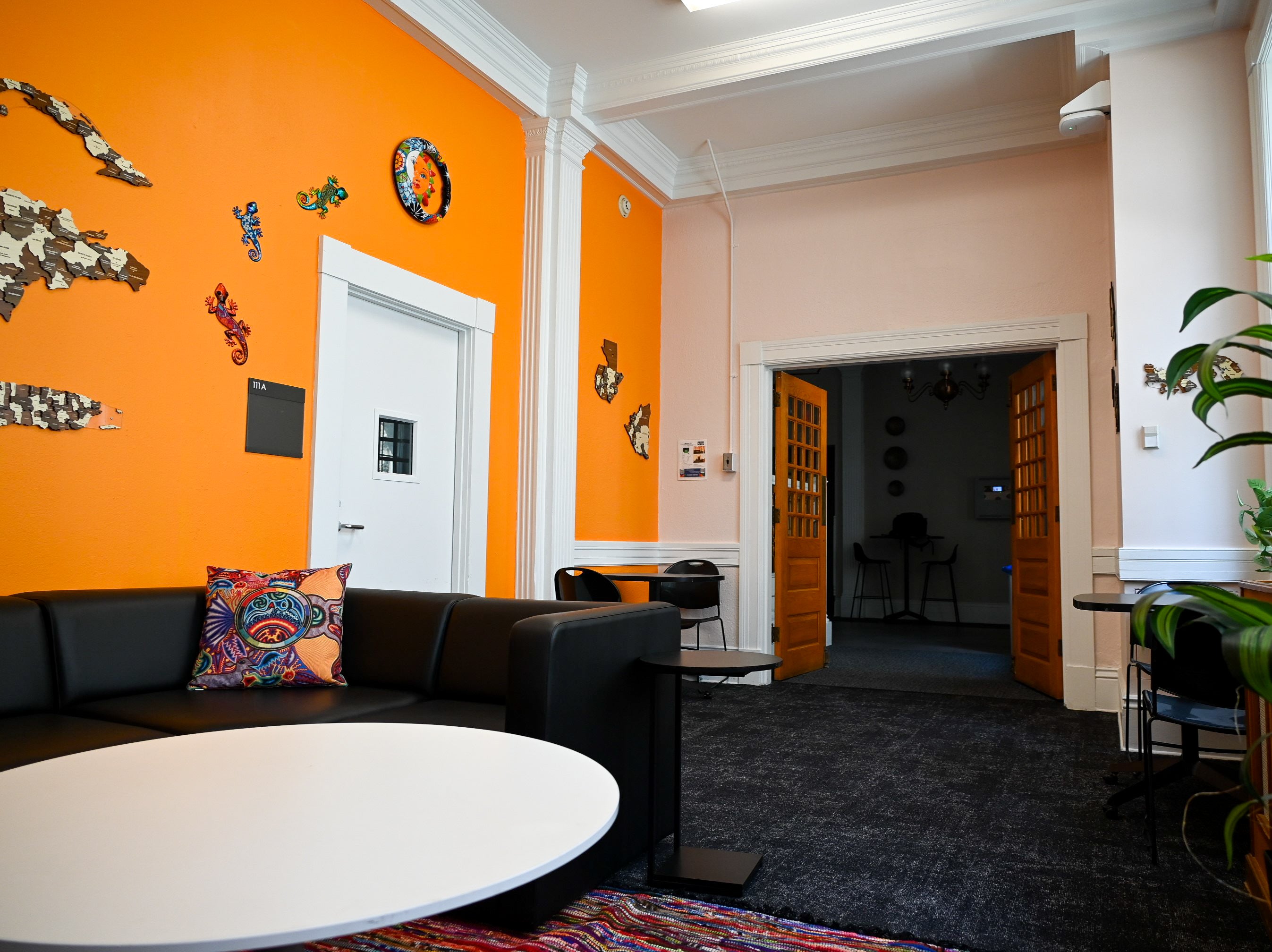 View of table and couches in Latine Lounge 111 in Eldred Hall