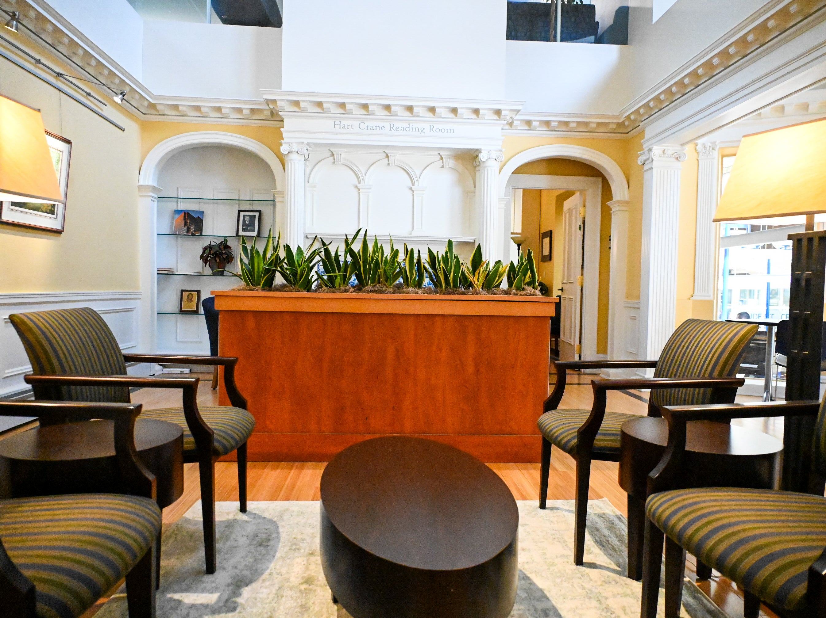 Chairs and planter in an empty room