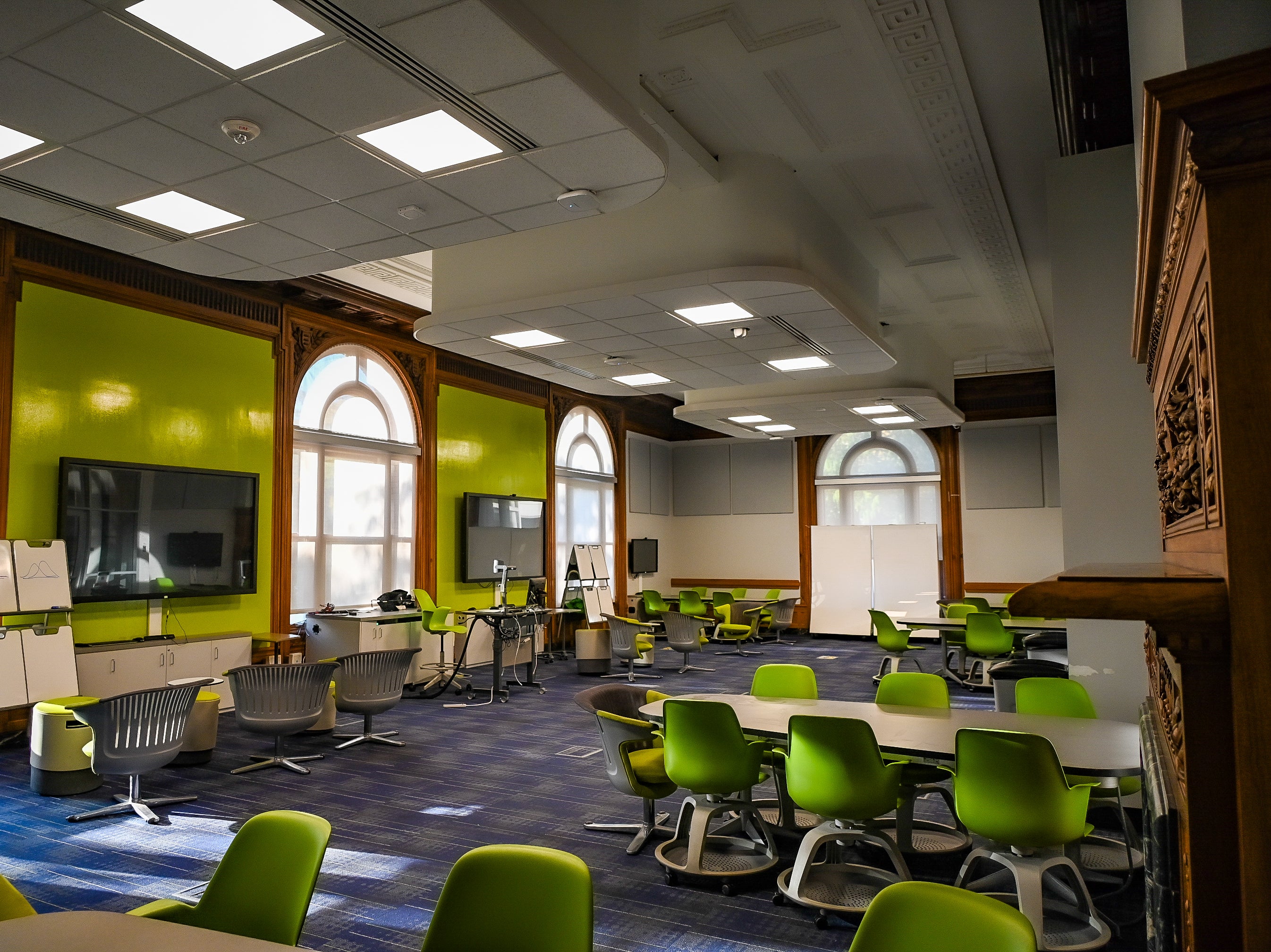 Empty Room 101 with classroom chairs arranged in pods