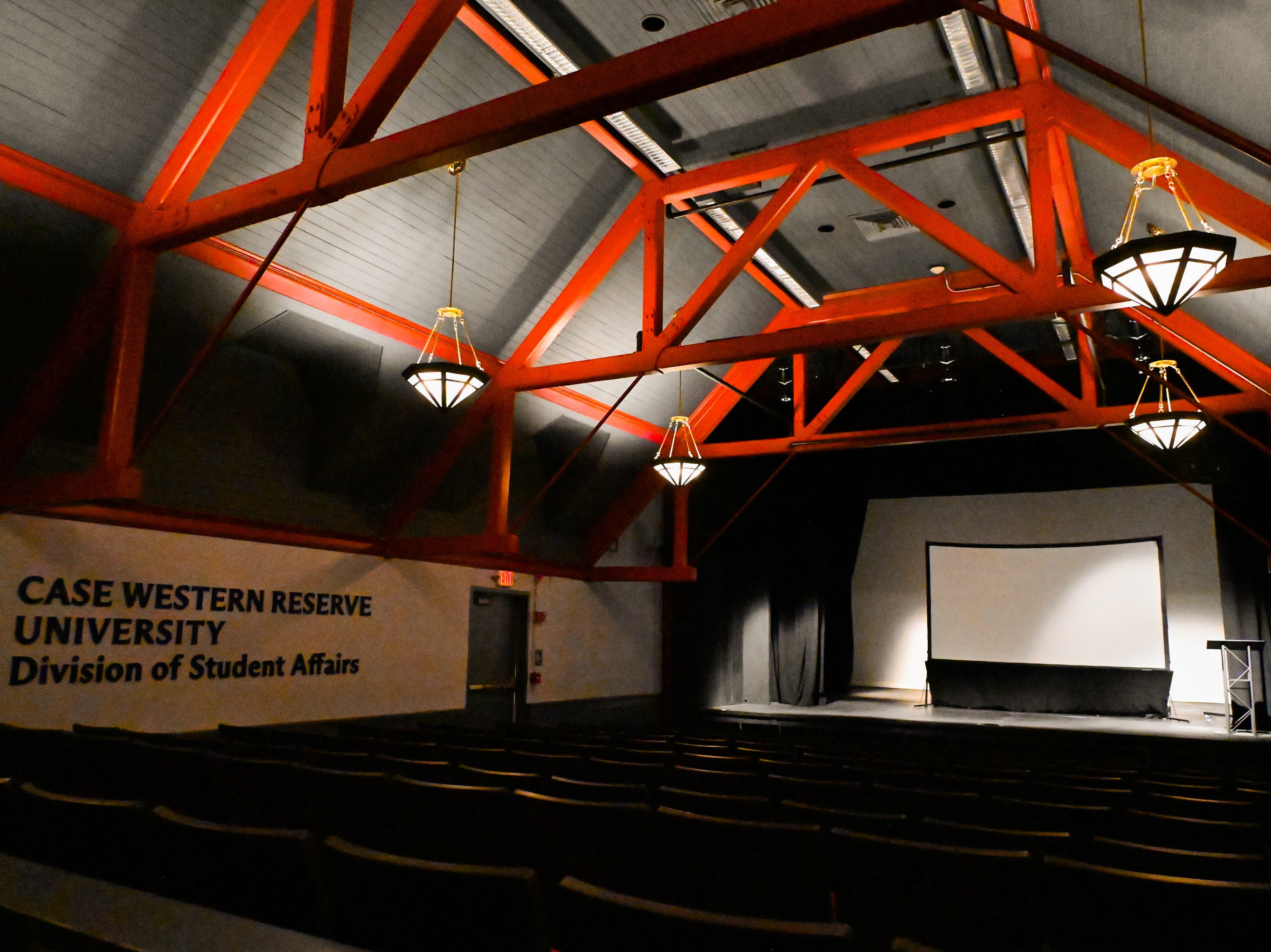 Empty auditorium with dimmed lights but bright lights on the stage