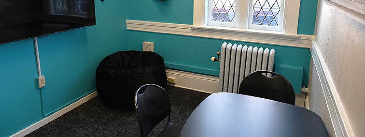 A small meeting room with a small table.
