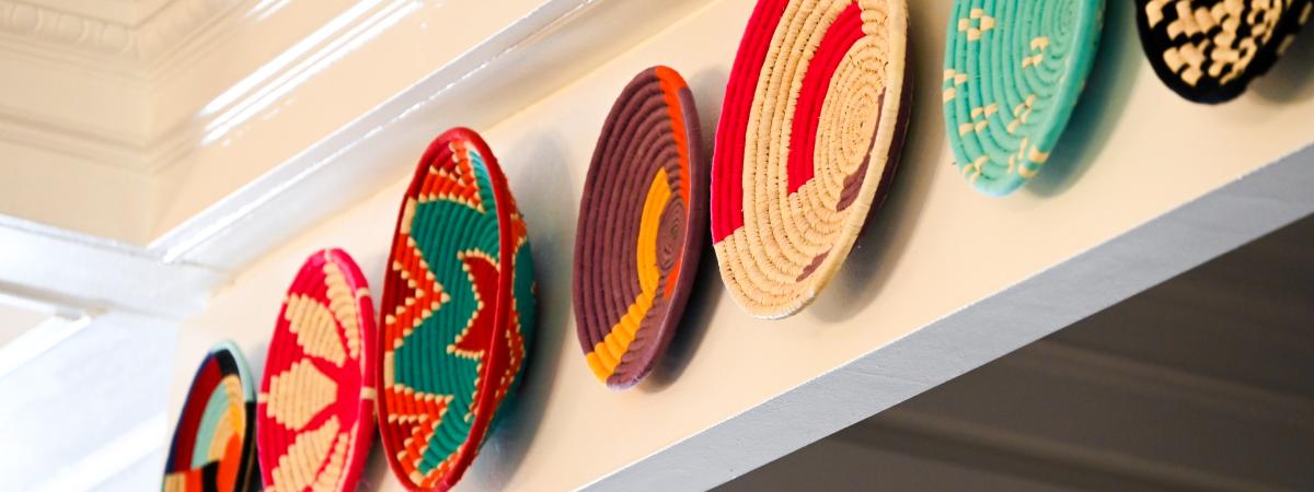 Colorful woven baskets on a wall