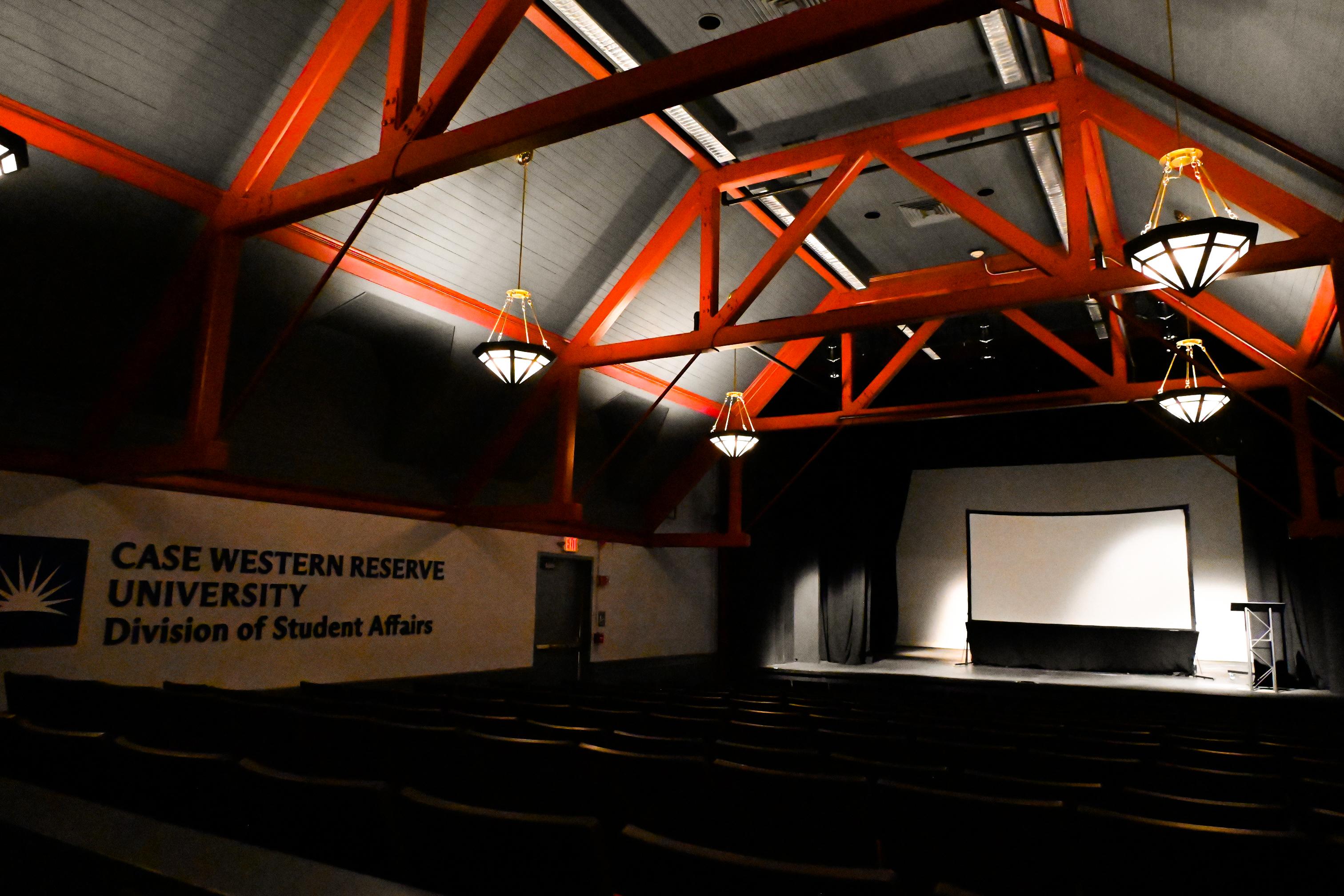 Empty auditorium with dimmed lights but bright lights on the stage