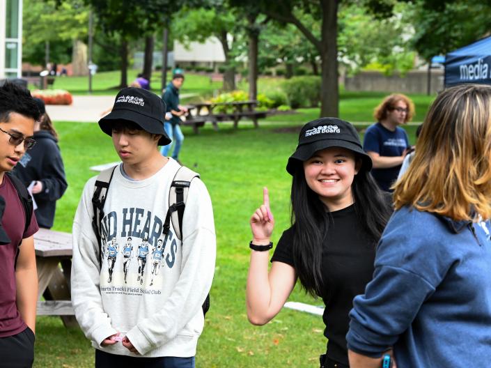 Students smiling at outdoor event