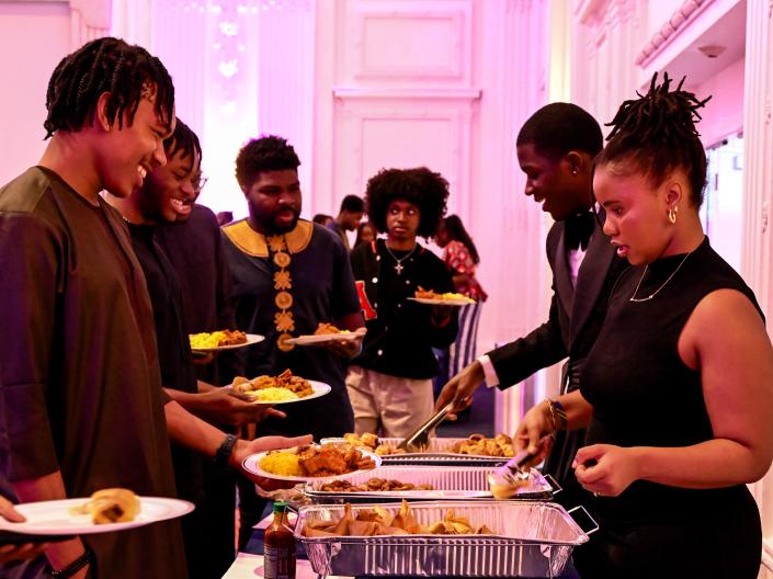 Buffet Line of students getting food at formal event
