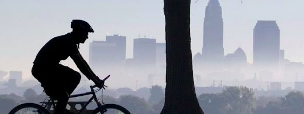 Cyclist with Cle skyline in background