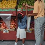 Photo of girl and mom at produce stand