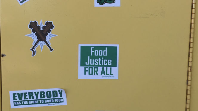 Locker with food justice stickers on it