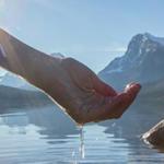 Hand holding water stock image
