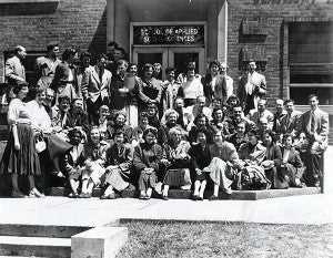 A black and white photo of a Mandel School graduating class