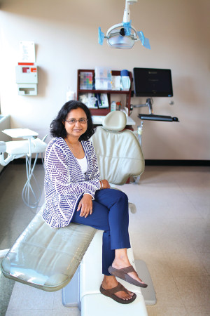 A photo of CWRU dental professor Suchitra Nelson sitting on a dental chair